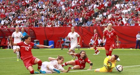 Swiss bow out after loss to hosts Canada