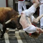 A Jandilla bull charges at a participant during the first "encierro" (bull-run) of the San Fermin Festival in Pamplona, northern Spain, on July 7th. Photo: Ander Gillenea/AFP
