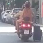 Barcelona scooter pair filmed pulling suitcase