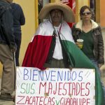 A man holds a sign reading "Welcome Their Majesties. Zacatecas and Guadalupe are your home" in Zacatecas, Mexico, on July 1, 2015, during the visit of Spanish King Felipe and Queen Letizia.Photo: Hector Guerrero/AFP