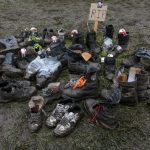 Some metal fest visitors evidently gave up on their shoes as the fest opened with rain and mud, creating a small graveyard for their soiled sneakers.Photo: DPA