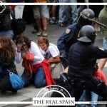 One postcard depicts horrified onlookers as police beat up a protestor. Under Spain's new citizens' security law, unauthorized protesters could be fined up to €600,000 ($663,000). Photo: The Real Spain