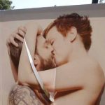 Kissing art exhibition vandalized in France