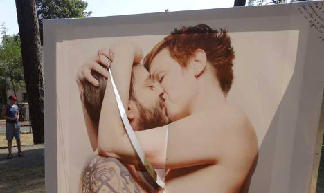 Kissing art exhibition vandalized in France