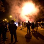 Police clash with far-right over refugees