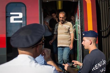 Hundreds of migrants arrive in Vienna on trains