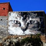 A cat's face stares out from a wall in Fanzara.Photo: Jose Jordan / AFP