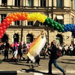 Marchers carry a rainbow made of balloons.Photo: Sophie Inge