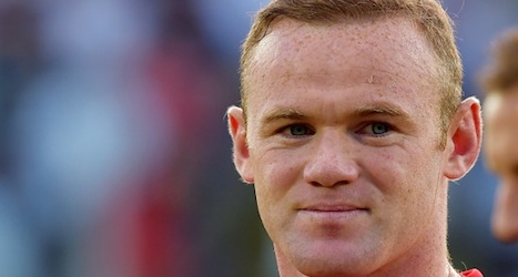 Rooney claims record in England win over Swiss