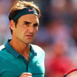 Federer sets up clash with big serving Isner
