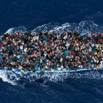 Refugees are packed onto a boat 25 kilometres from the Libyan coast in this image encapsulating the rescue operations on the Mediterranean.Photo: Massimo Sestini, Italy