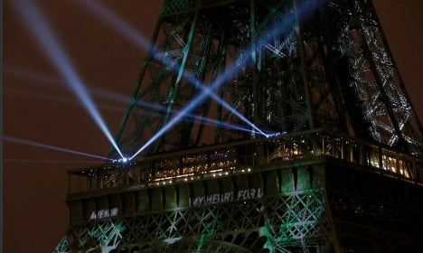 Eiffel Tower goes green for Paris climate summit
