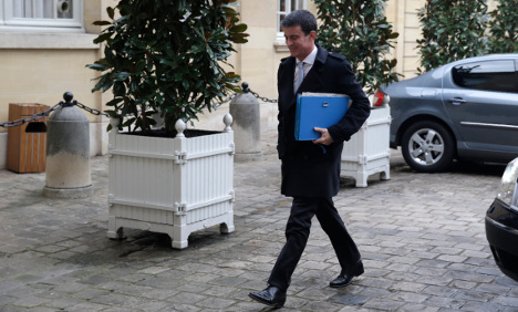 French PM bows to pressure after taxi drivers protest