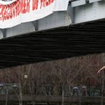 Femen welcome Rouhani with mock hanging on Paris bridge