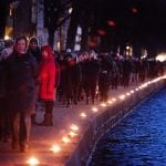 A chain of 1,800 candles lit on a 3.6 kilometre (2.2 mile) route between the two locations attacked. Photo: Claus Bech/Scanpix 
