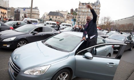 Uber goes offline in France to support minicab strike