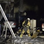 Firefighters tackle two burning buildings