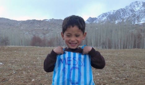 Adorable Messi fan in plastic bag shirt warms hero's heart