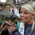 Katja Patallas the Saxon fish queen kisses a carp in time-honoured German tradition to open the fishing season.Photo: Photo: DPA