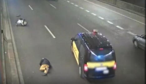 Outrage: taxi swerves to avoid fallen biker but then drives on