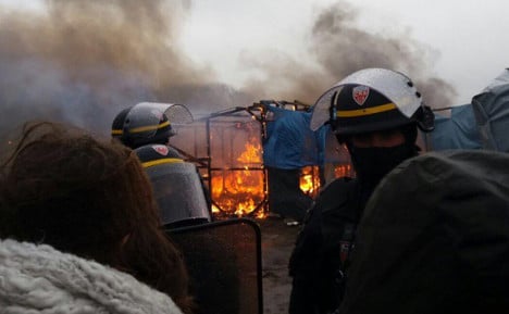 Shelters burned at Calais camp as demolition continues