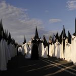 Penitents of the "El Cachorro" brotherhood parade during the Easter procession in Seville.Photo: Cristina Quicler/AFP