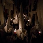 Penitents of the "Jesus Yacente" brotherhood hold candles during a Holy Week procession in the northwestern Spanish city of Zamora.Photo: Cesar Manso/AFP