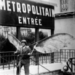 A strike on the Paris Metro in 1935 forced Parisians to find alternative means to get to work. Actually Birdman here was on his way to an inventors competition and thought it wuld be best to take the Metro. Buy this image by clicking here: <a href="http://www.parisenimages.fr/en/collections-gallery/574-6-man-hang-gliders-concours-lepine-french-invention-competition-paris-1935">www.parisenimages.fr/en</a>