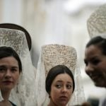 Women wearing the traditional mantilla, or Spanish lace shawl. Photo: Cristina Quicler/AFP