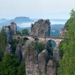 <b>Saxon Switzerland National Park.</b> A major attraction of this Saxony park outside Dresden is the Bastei Bridge pictured here, built on a one-million-year-old rock formation that towers 194 metres above the Elbe River. The rocks make the park a popular destination especially for climbers and hikers.Photo: <a href="http://bit.ly/1qRgL2v">Thomas Wolf</a>/Wikimedia Commons.