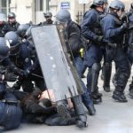 Masked youths clash with police in Paris protest