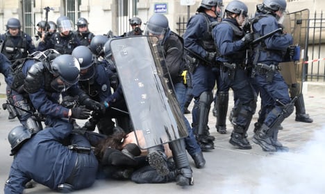Masked youths clash with police in Paris protest