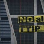 Activists scale skyscraper in Spain to protest US trade deal