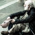 Italian boy gives his pocket money to a homeless man