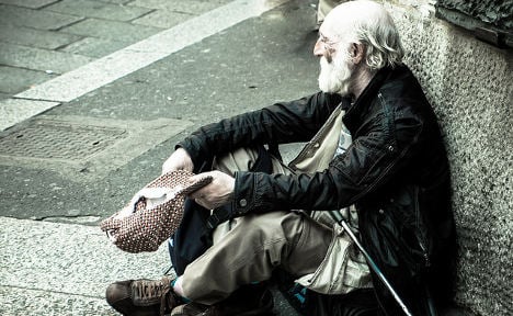 Italian boy gives his pocket money to a homeless man