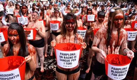 Topless protesters get bloody over Pamplona bull run
