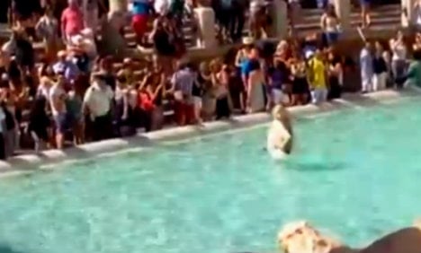 Ekberg wannabe dragged out of Rome’s Trevi Fountain