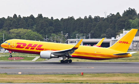 Cargo jet slides onto road after overshooting runway