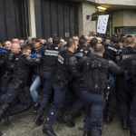How can France solve the problem of its bursting jails?