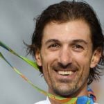 Swiss cycling champ wins time-trial gold in Rio