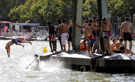 Parisians ignore 1923 ban to take the plunge in waterway
