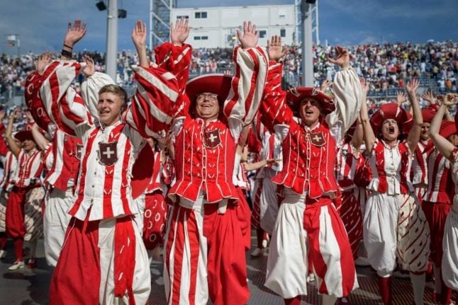 Swiss people in traditional clothing. Photo: FABRICE COFFRINI / AFP