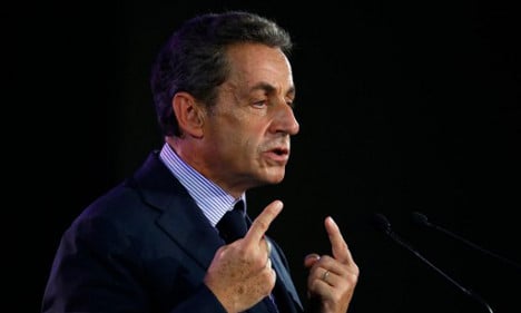 Embattled Sarkozy defiant over presidential bid