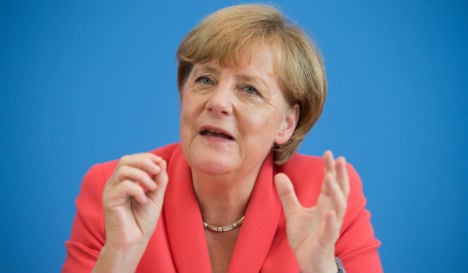 Merkel drops 'we can do it' rallying cry on migrants