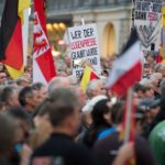Pegida take to Dresden streets – to march against Pegida