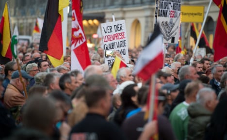 Pegida take to Dresden streets - to march against Pegida