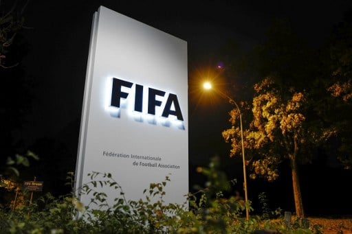 Swiss police search homes in football corruption probe