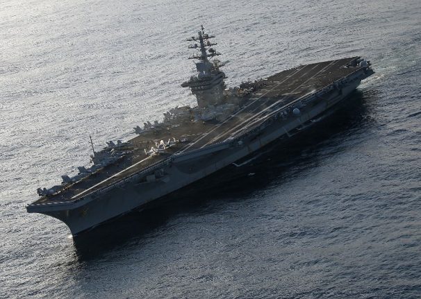 Stowaway French cops in hot water after jumping aboard US aircraft carrier