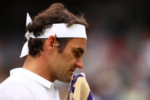 Federer wins comeback match in Australia