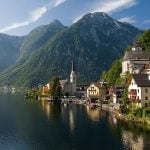 Bouncers guard Hallstatt’s church doors during services to keep tourists away